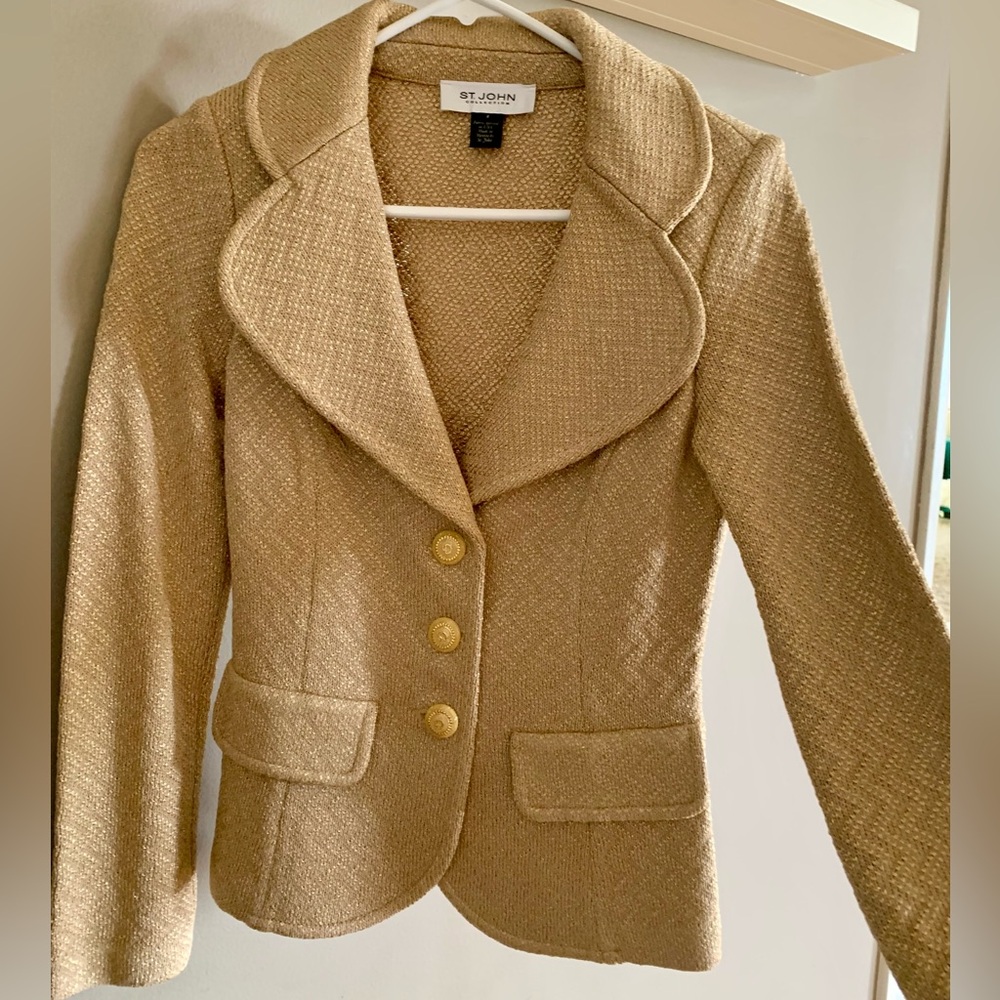 Fitted St. John gold blazer with gold buttons Size 2. Sewn in shoulder pads.